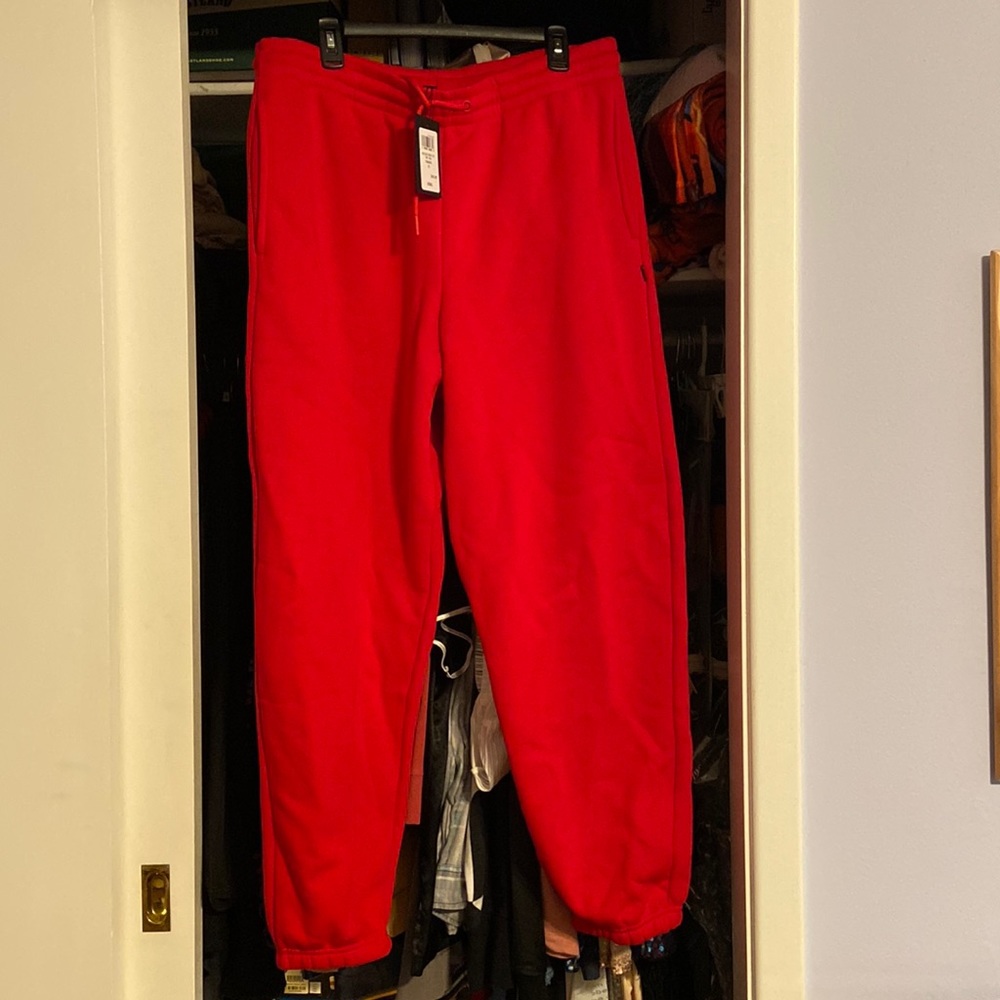 Men’s extra large red sweatpants never worn. Inseam 30 inches